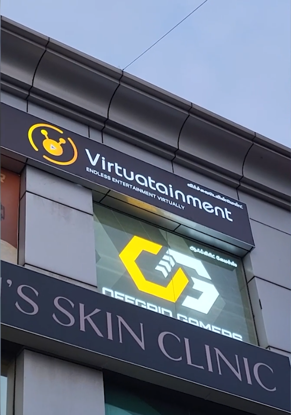 The illuminated Virtuatainment sign — Endless Entertainment Virtually — on the building facade at 15 Velachery Road, Chennai